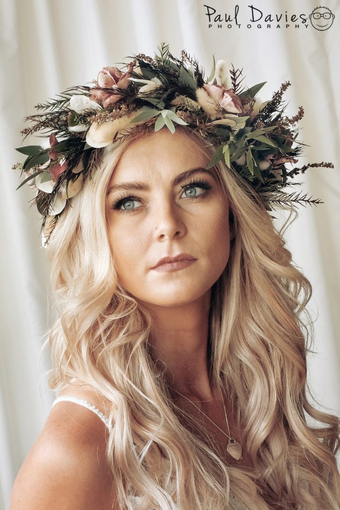 Bride at Oxwich Bay Hotel with flowers in hair