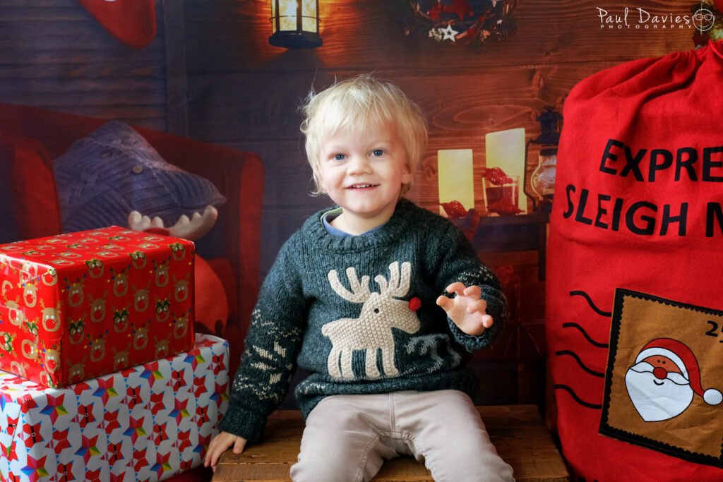 Boy wearing Christmas Jumper.