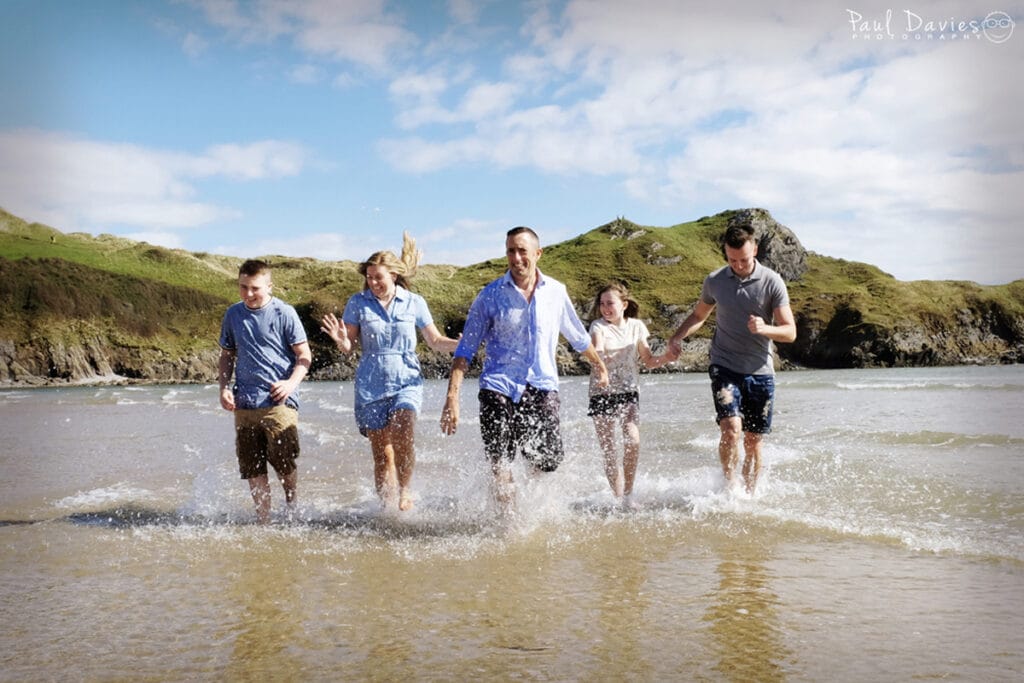 Fun family of 5 photoshoot at Three Cliffs Bay Gower