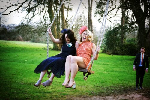 Girls on a swing at Fairyhill Gower
