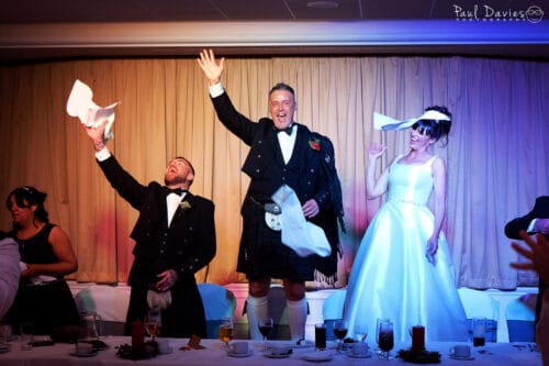 Bride, groom and bestman singing at the Diplomat Hotel Llanelli.